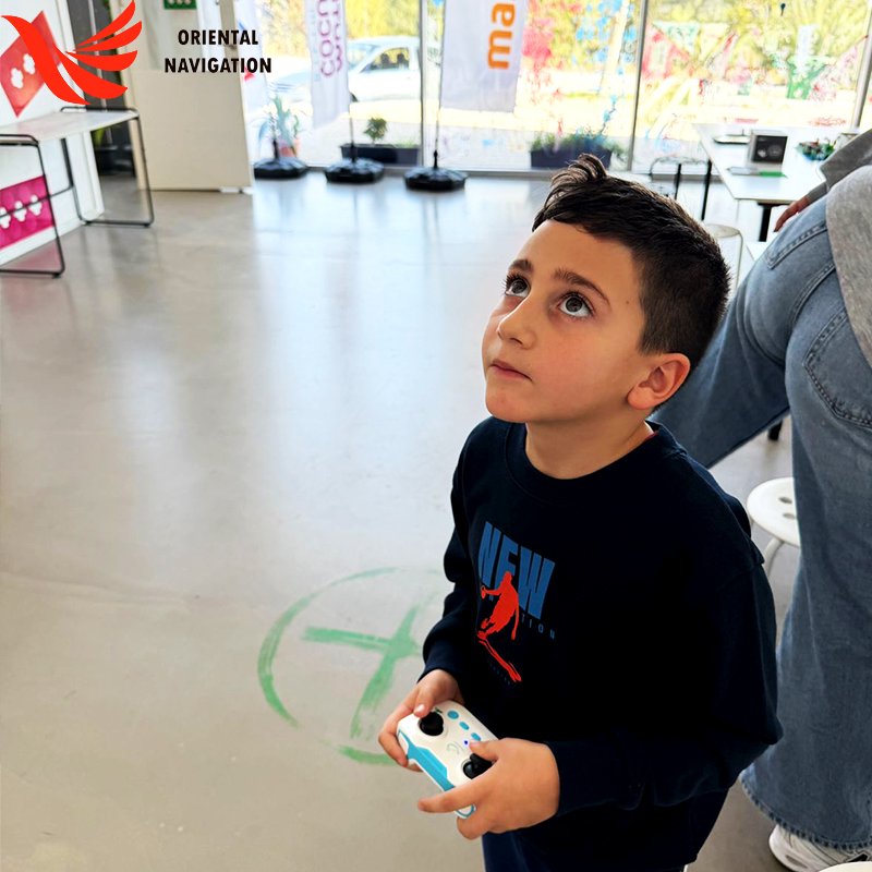 Children play soccer with drones